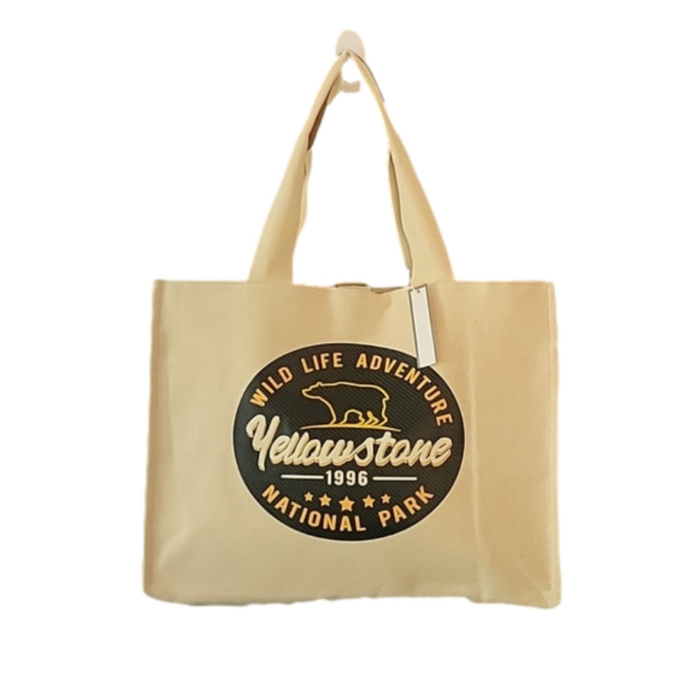 Yellowstone tan, thick, tote with inner liner. NWT
